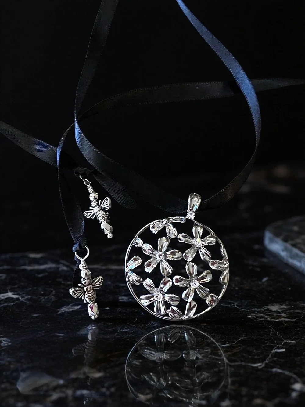 Silver Toned Floral Cutout Pendant Necklace on Black Satin Ribbon